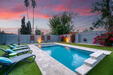 Keuken spatwand met foto Sunset over a luxury pool  © Allison