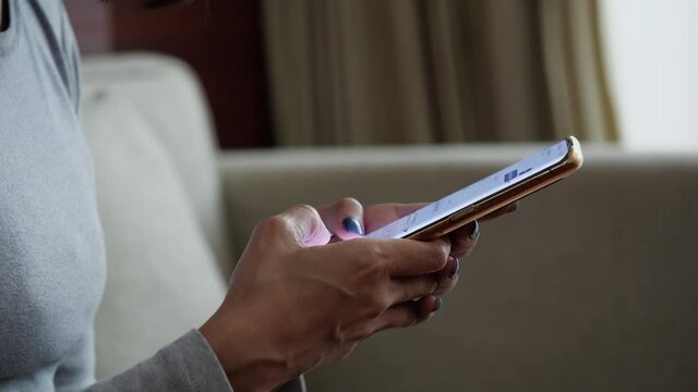 Hand woman using the cell smartphone to send text chat messages mobile to people