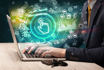 Business hand typing on a modern laptop