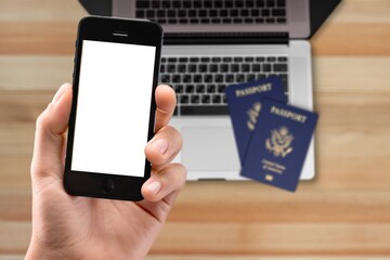 Digital proof of vaccination certificate concept, a mobile phone with passports and computer