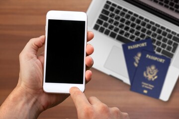 Digital proof of vaccination certificate concept, a mobile phone with passports and computer