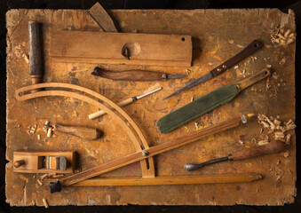 Hand tools Wood on an old wooden workbench (Drill Jig Saw plane chisel) occupation concept