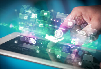 Close-up of a hand using tablet, currency concept