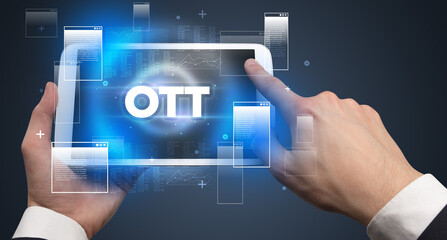 Close-up of a hand holding tablet