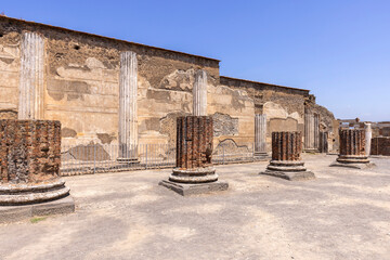 Ruins of an ancient city destroyed by the eruption of the volcano Vesuvius in 79 AD near Naples, remains of the Basilica, Pompeii, Italy. - obrazy, fototapety, plakaty