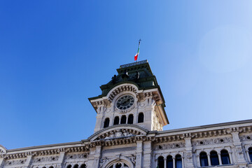 Fototapeta na wymiar Tower of Trieste city hall - municipality in Trieste, Italy - low angle view