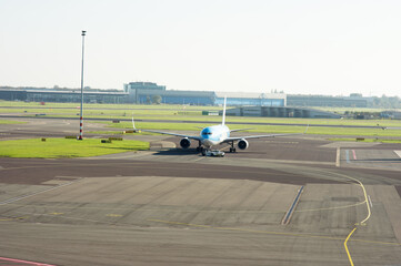 Commercial airplane on the runway ready for take off on Schiphol in the Netherlands