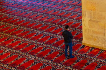 Praying Muslim Man. Muslim man praying in the mosque background photo