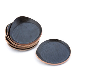 Set of black rustic wooden drink coasters isolated on white background with space for text