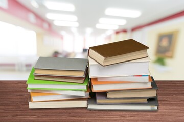 Hardcover law books stacked on wooden table on blur room background, Law Office, pile of books