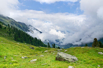 Above the clouds in the high mountains between the peaks.