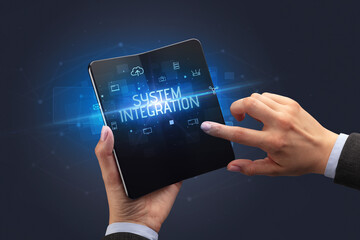 Businessman holding a foldable smartphone, security concept