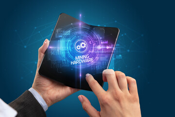 Businessman holding a foldable smartphone, technology concept