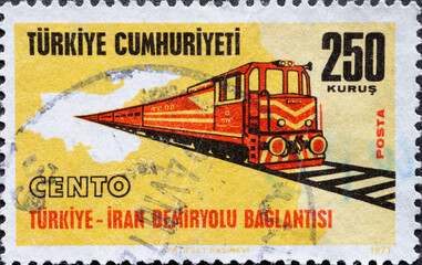 Turkey - circa 1971: A post stamp printed in Turkey showing a rail link to Iran. Locomotive on the...