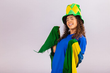Brazilian fan. wearing Brazilian flag in a portrait, Brazilian fan celebrating football or soccer...