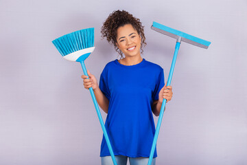 Cleaning woman holding a squeegee and a broom. house cleaning concept