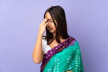 Young Indian woman isolated on purple background with tired and sick expression