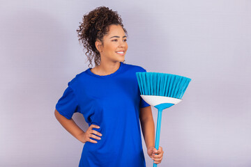 Housewife woman. Cleaner. Young man holding broom on white background with free space for text.
