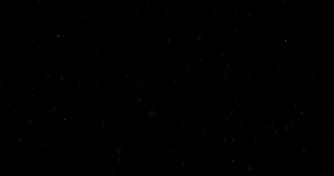 Small blurred glitter flickering particle dots falling on black empty background seamless loop greeting animation background.