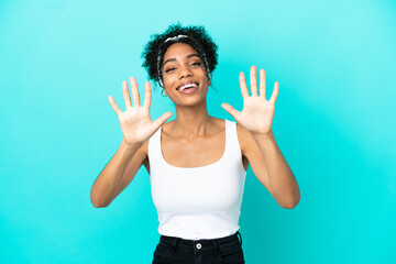 Young latin woman isolated on blue background counting ten with fingers