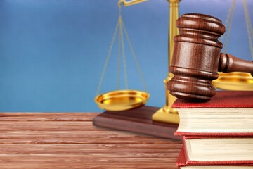 Legal Law and Justice concept, law book with a wooden judges gavel on table