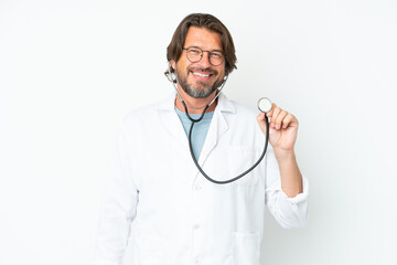 Senior dutch man isolated on white background wearing a doctor gown and with stethoscope