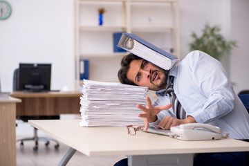 Young male employee working in the office