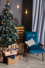 Stylish loft room interior with beautiful Christmas tree. dark blue and brown and gold colors. new years atmosphere decoration
