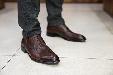 The man wears shoes.