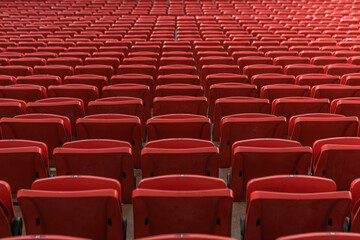 rows of red seats in a stadium