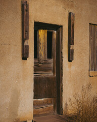 Old brown wooden door of an abandoned building