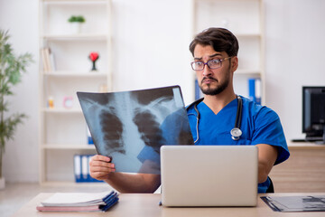 Young male doctor radiologist working in the clinic