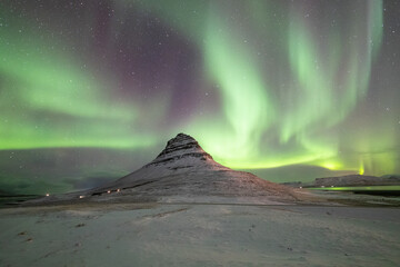 Fototapeta na wymiar Northern lights (aurora borealis) over Kirkjufell, Snaefellsnes Peninsula, Iceland