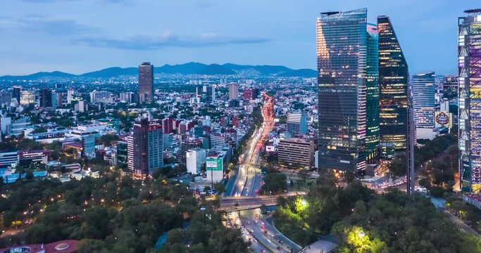 México, CDMX, Beautiful Aerial Drone Hyperlapse view of urban modern Mexico City center with tall skyscrapers and flashing City lights at night, drone images