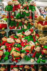 Fototapeta na wymiar Christmas elfs and teddys. Christmas decorations on sale in a store in England.