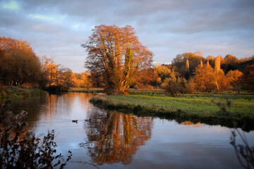 Fototapeta premium Winter sunset over the River Wey in Godalming, Surrey, UK