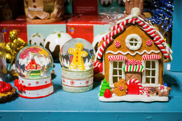 Naklejka premium Little houses. Christmas decorations on sale in a garden centre, near Lacock, England