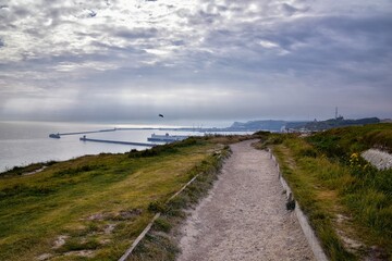 White Cliffs of Dover. Close up detailed landscape view of the cliffs from the walking path by the sea side. September 14, 2021 in England, United Kingdom, UK.