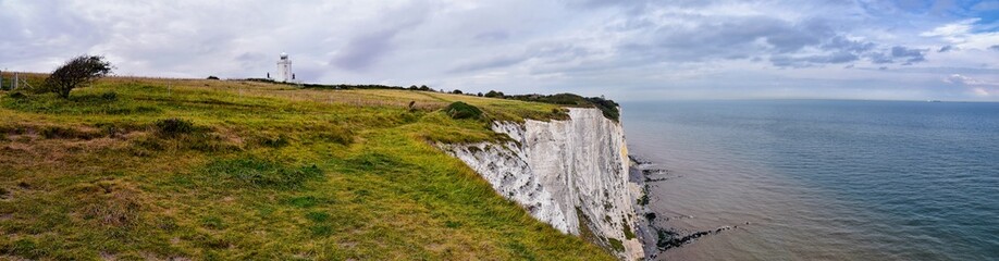 Fototapeta premium White Cliffs of Dover. Close up detailed landscape view of the cliffs from the walking path by the sea side. September 14, 2021 in England, United Kingdom, UK.