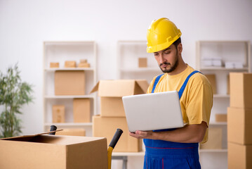 Young male contractor doing home relocation