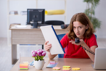 Young female designer working in the office