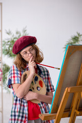 Young girl enjoying painting at home