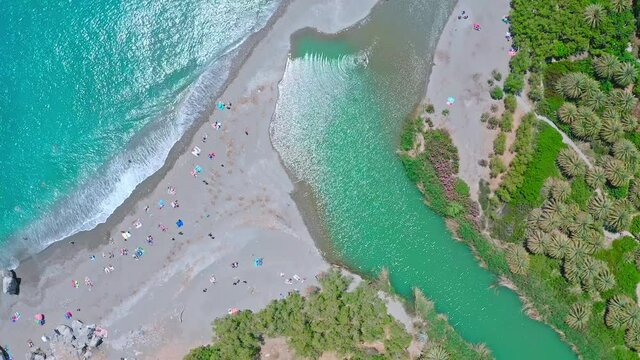 People relax on Preveli beach Crete island Greece aerial view