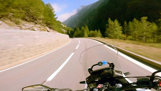 A highway motorcycle ride on a sunny summer day, at the Simplon Pass in Switzerland.