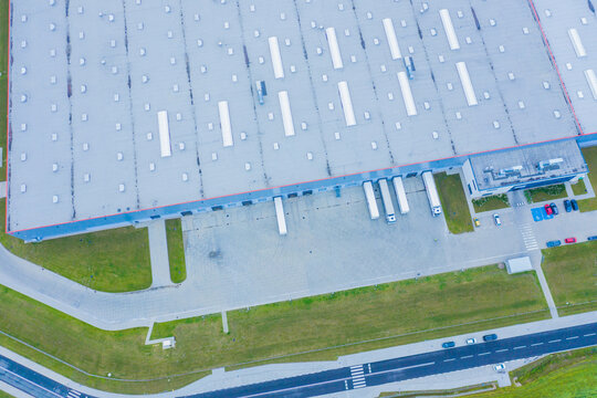 Aerial Shot of Industrial Warehouse Loading Dock where Many Truc