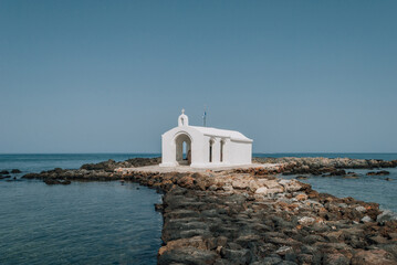 Agios Nikolaos Church, whitewashed chapel in sea, Georgioupoli