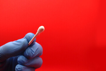 isolated white swab close-up - health care consept - covid test analyses - red background