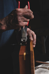 Obraz premium Man Holding Cutting tool