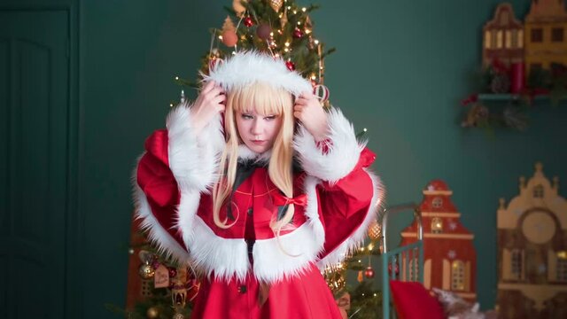 Little Red Riding Hood Posing for the photographer. New Year theme. Posing for the photographer