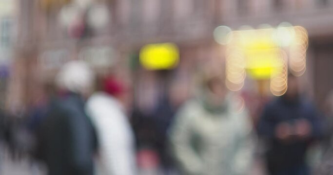 Moscow. Out of focus. People are walking along Arbat Street in the evening, intended only for pedestrians. Hand held.